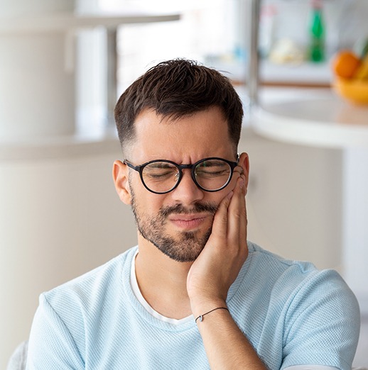 Grimacing man suffering from a toothache