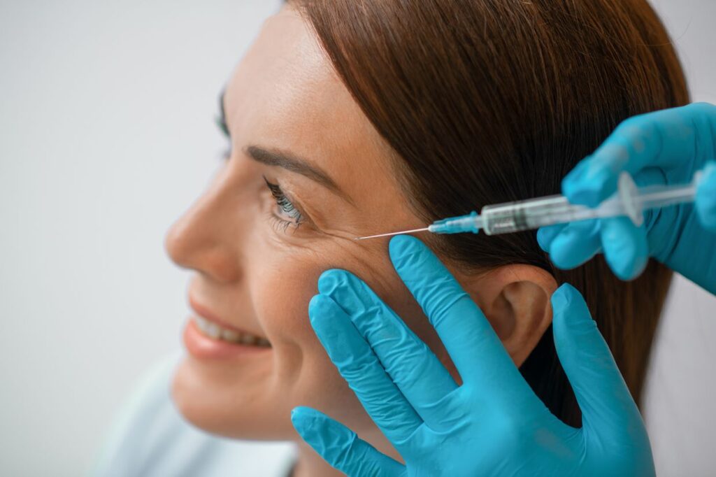 A woman getting a Botox injection.